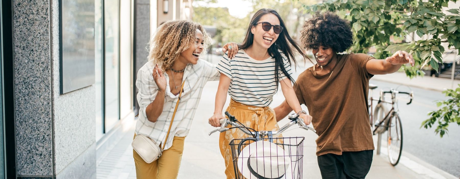 a group of people walking and riding bikes