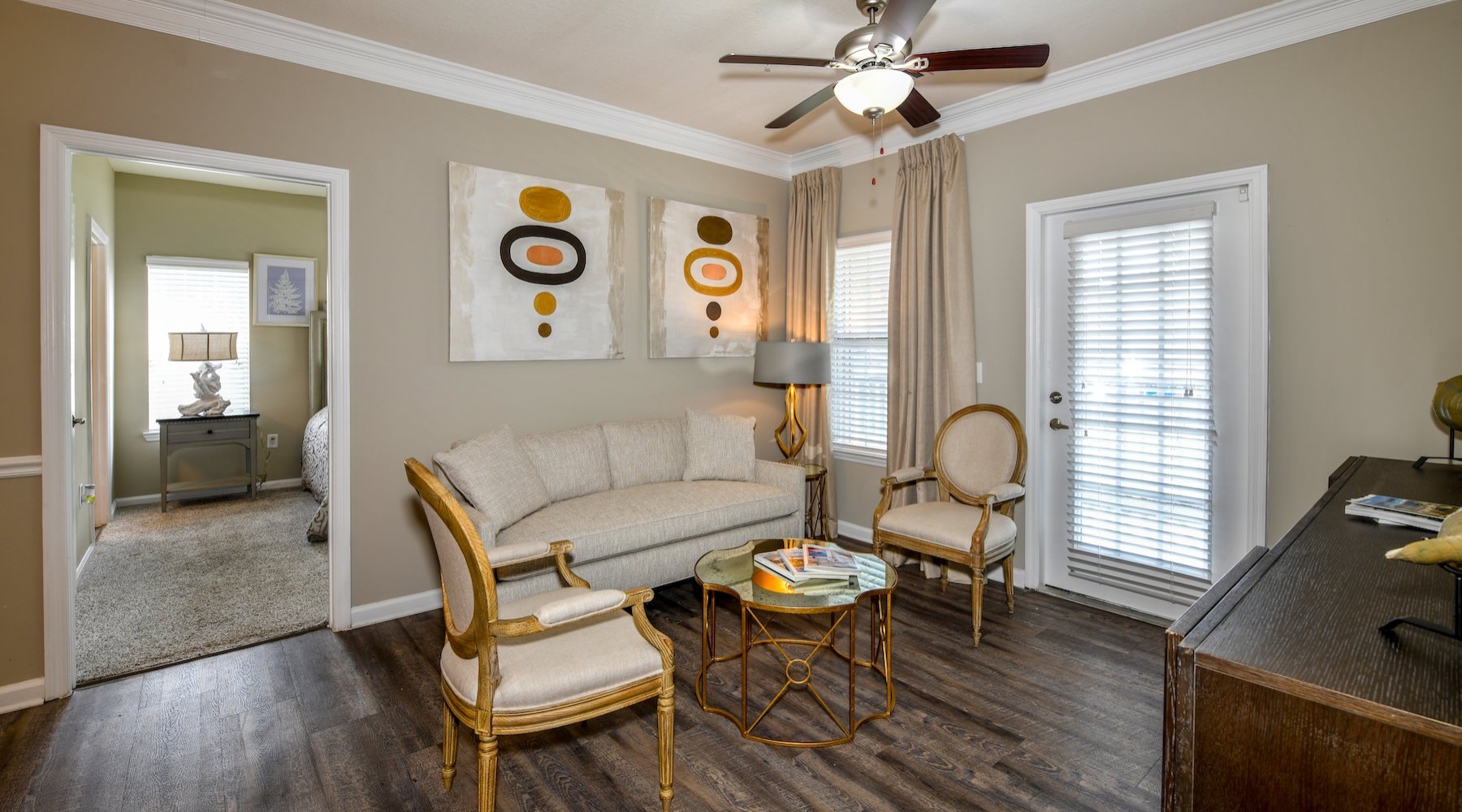 a living room with a couch and chairs