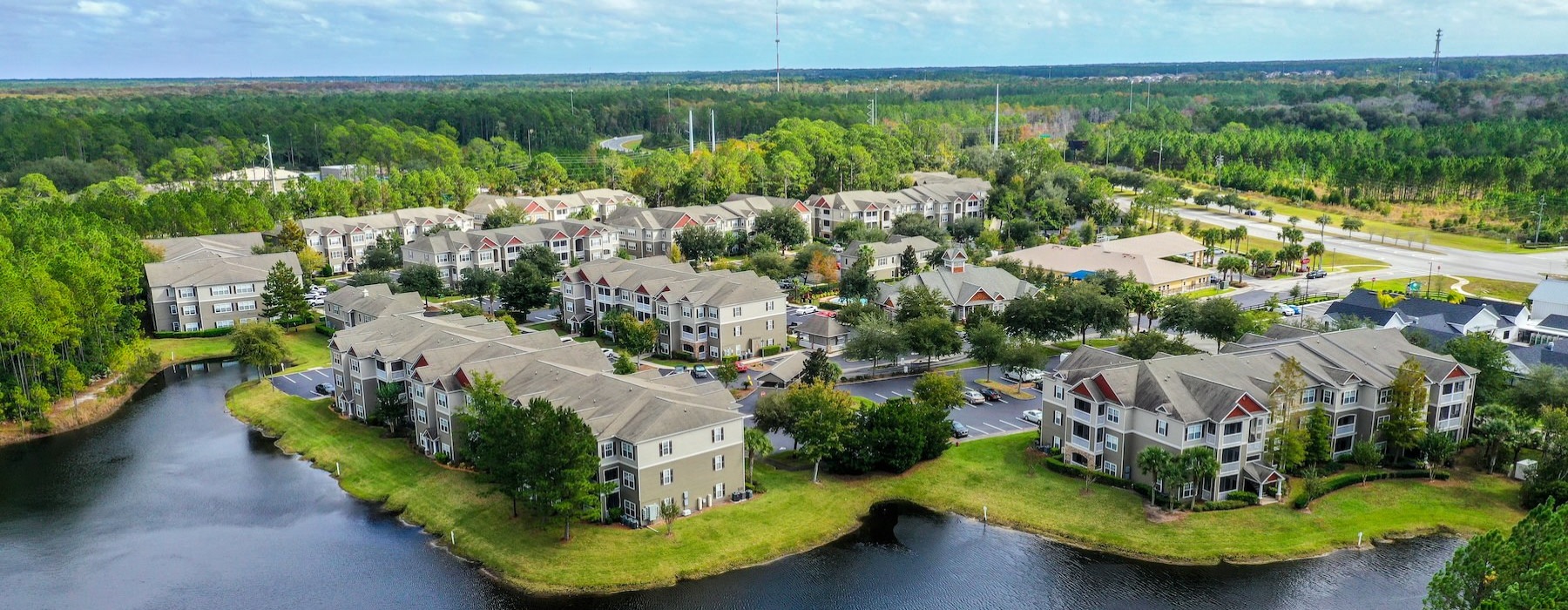 a river with houses and trees