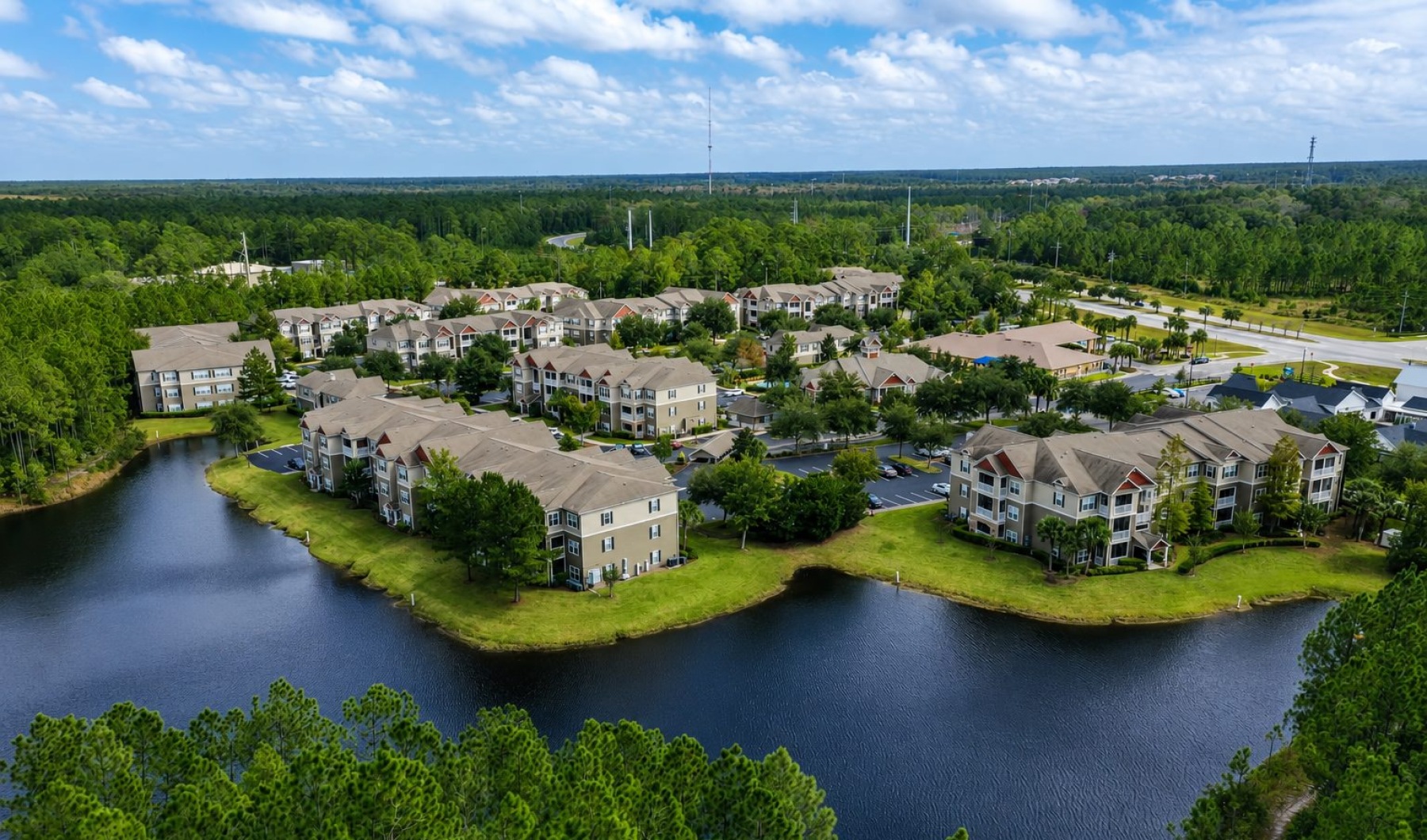 a river with houses and trees